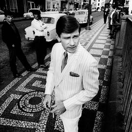 A Male Model Wearing A Suit By Ratner by Leonard Nones