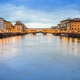 Arno River And Ponte Vecchio Bridge Of by Giorgiomagini