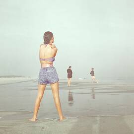 Back View Of Three People At A Beach by Serge Balkin