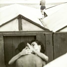 Couple Kissing By A Model Wearing Westwood Trunks by Chadwick Hall