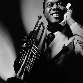 Louis Armstrong Holding A Trumpet by Anton Bruehl