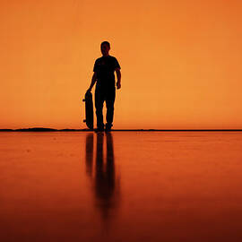 Silhouette Of Man With Skateboard by Mgs
