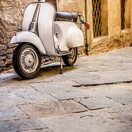 Vespa Scooter In Old Italian Alley by Giorgiomagini